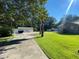 Long driveway leading to home and garages at 1229 Central Ave, Summerville, SC 29483