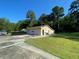 Detached garage with three garage doors and a large yard at 1229 Central Ave, Summerville, SC 29483