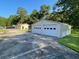 Tan two-car garage with white doors and additional storage at 1229 Central Ave, Summerville, SC 29483