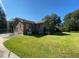 Brick house with a large backyard and driveway at 1229 Central Ave, Summerville, SC 29483