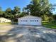 Tan two-car garage with white doors at 1229 Central Ave, Summerville, SC 29483
