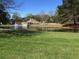 Community pond with fountain and clubhouse view at 7945 Timbercreek Ln # E, North Charleston, SC 29418