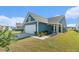 Blue house with white garage door and landscaped yard at 190 Garden Gate Way, Summerville, SC 29486