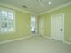 Light-filled bedroom with green walls and balcony access at 775 Navigators Run, Mount Pleasant, SC 29464