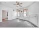 Simple bedroom with carpet, fireplace and two windows at 380 Ashley Ave, Charleston, SC 29403