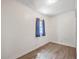 Small bedroom with hardwood floors and a window at 380 Ashley Ave, Charleston, SC 29403