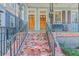 Welcoming front porch with double doors and mosaic tile at 380 Ashley Ave, Charleston, SC 29403