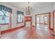 Spacious dining room with hardwood floors and views to kitchen at 380 Ashley Ave, Charleston, SC 29403