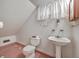 Small bathroom with pedestal sink, toilet and shower at 380 Ashley Ave, Charleston, SC 29403