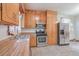 Kitchen with wood cabinets, stainless steel appliances, and tile floor at 380 Ashley Ave, Charleston, SC 29403