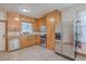 Kitchen with wood cabinets, stainless steel appliances, and tile floor at 380 Ashley Ave, Charleston, SC 29403