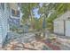 Small patio with stone table and benches at 380 Ashley Ave, Charleston, SC 29403