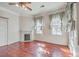 Spacious bedroom with hardwood floors and a fireplace at 380 Ashley Ave, Charleston, SC 29403