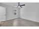 Bright bedroom with window, ceiling fan and hardwood floors at 1586 Highway 15, Saint George, SC 29477