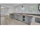 Modern kitchen with gray cabinets, wood countertop and stainless steel appliances at 1586 Highway 15, Saint George, SC 29477