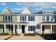Three-unit townhouse building with front porches and attached garages at 223 Abercom Place Dr, Moncks Corner, SC 29461