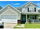 Two-story house with attached garage and landscaping at 506 Holiday Dr, Summerville, SC 29483