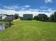 House with a large backyard and a pond view at 506 Holiday Dr, Summerville, SC 29483