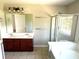 Bathroom with double vanity, shower, and bathtub at 506 Holiday Dr, Summerville, SC 29483