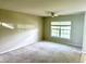 Spacious carpeted bedroom with large window and ceiling fan at 506 Holiday Dr, Summerville, SC 29483