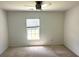 Bright bedroom with carpet, a window, and ceiling fan at 506 Holiday Dr, Summerville, SC 29483
