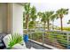 Private balcony overlooking pool and palm trees at 316 Cooper River Dr, Mount Pleasant, SC 29464