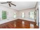 Spacious bedroom with hardwood floors and window at 8083 Point Of Pines Rd, Edisto Island, SC 29438