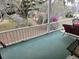 Screened porch overlooking backyard with mature trees and landscaping at 8083 Point Of Pines Rd, Edisto Island, SC 29438