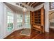 Kitchen features wood cabinets, exposed beams, stainless steel appliances, and hardwood floors at 8083 Point Of Pines Rd, Edisto Island, SC 29438