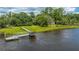Private dock extending into the calm water, offering serene waterfront views at 8083 Point Of Pines Rd, Edisto Island, SC 29438