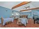 Elegant dining area with a bar and a grand piano, ideal for events at 8083 Point Of Pines Rd, Edisto Island, SC 29438