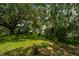 Charming two-story home nestled amongst lush greenery and mature trees at 8083 Point Of Pines Rd, Edisto Island, SC 29438