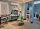 Modern salon styling station with a green chair and hair dryers at 8083 Point Of Pines Rd, Edisto Island, SC 29438