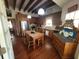 Kitchen with wood cabinets, hardwood floors, and exposed beams at 8083 Point Of Pines Rd, Edisto Island, SC 29438