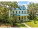 Two story home with metal roof and large yard at 8083 Point Of Pines Rd, Edisto Island, SC 29438