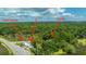 Aerial view showing the main house, a separate building, and surrounding lush greenery at 8083 Point Of Pines Rd, Edisto Island, SC 29438