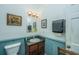 Clean bathroom with sink, toilet, and mirror at 8083 Point Of Pines Rd, Edisto Island, SC 29438