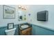 Small bathroom with sink, toilet, and paper towel dispenser at 8083 Point Of Pines Rd, Edisto Island, SC 29438