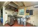 Kitchen area with fryer, sink, and trash cans at 8083 Point Of Pines Rd, Edisto Island, SC 29438