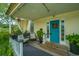 Inviting front porch with seating area, perfect for relaxing at 8083 Point Of Pines Rd, Edisto Island, SC 29438
