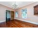Elegant dining room with hardwood floors, chandelier, and built-in hutch at 8083 Point Of Pines Rd, Edisto Island, SC 29438