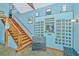 Post office-themed interior with mailboxes and a staircase leading upstairs at 8083 Point Of Pines Rd, Edisto Island, SC 29438