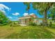 Historic building with a screened porch and large yard, offering a peaceful atmosphere at 8083 Point Of Pines Rd, Edisto Island, SC 29438