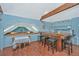 Bar area with wood bar top, seating, and a small dining table at 8083 Point Of Pines Rd, Edisto Island, SC 29438
