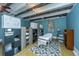 Esthetician room with a massage table and storage shelves at 8083 Point Of Pines Rd, Edisto Island, SC 29438