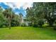 Two-story home with a wrap-around porch, nestled in a tranquil, wooded setting at 8083 Point Of Pines Rd, Edisto Island, SC 29438