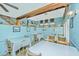 Casual dining area with wooden chairs and tables, suitable for small groups at 8083 Point Of Pines Rd, Edisto Island, SC 29438