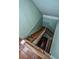 Wooden staircase with simple railing leading upstairs at 8083 Point Of Pines Rd, Edisto Island, SC 29438
