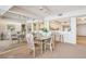 Dining area with glass table and kitchen views at 4405 Ocean Clb, Isle of Palms, SC 29451