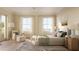 Bright bedroom with large windows and access to a private balcony at 284 Meeting St # 202, Charleston, SC 29401